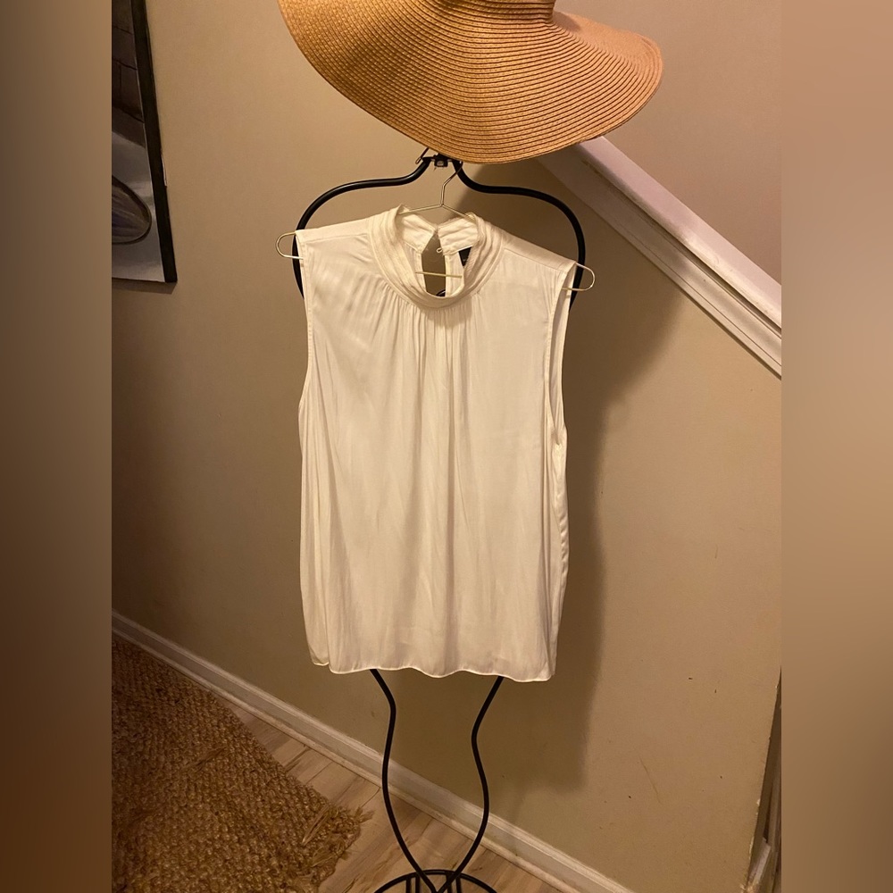 Really pretty ivory sleeveless high neck blouse.